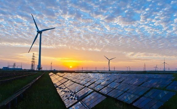 Windturbines with a sunset in the distance